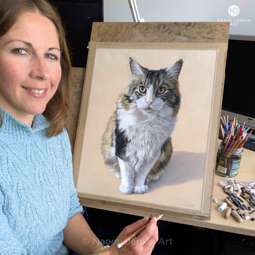 Naomi Jenkin with her pastel pet portrait of Axel the Norwegian Forest Cat. Naomi Jenkin with her pastel pet portrait of Axel the Norwegian Forest Cat.