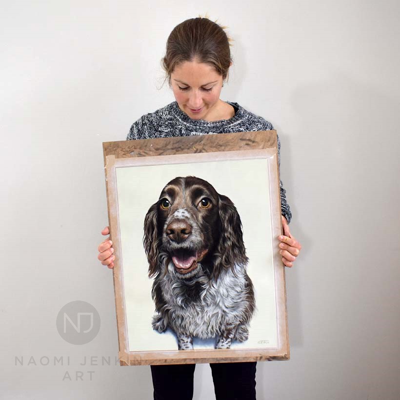 Naomi Jenkin with portrait of Molly the Springer Spaniel.
