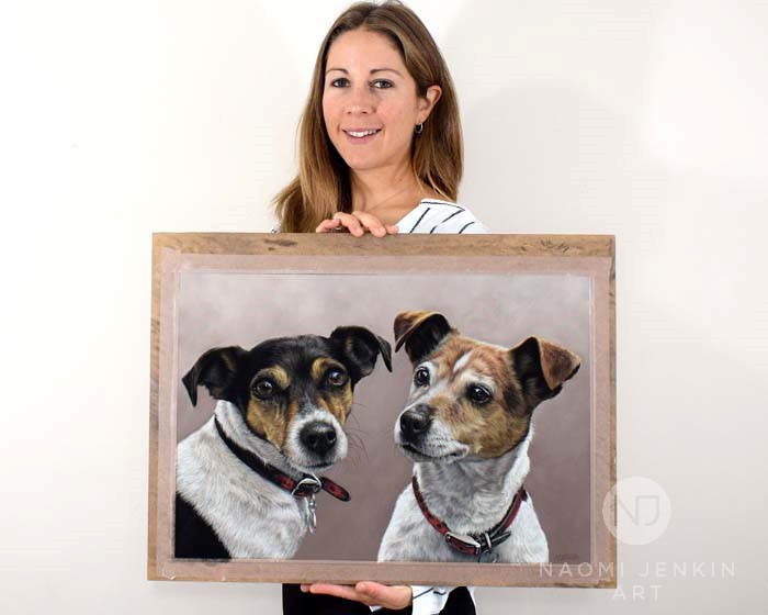 Pet portrait artist Naomi Jenkin with dog portrait of two Jack Russells