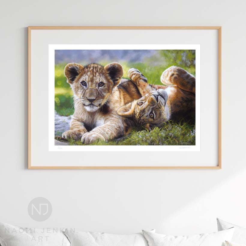 Limited-edition wildlife art print of two lion cubs. From an original by Naomi Jenkin Art.